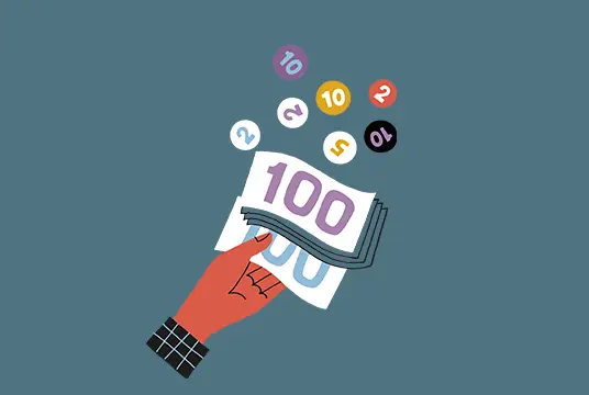 Hand håller i pengar